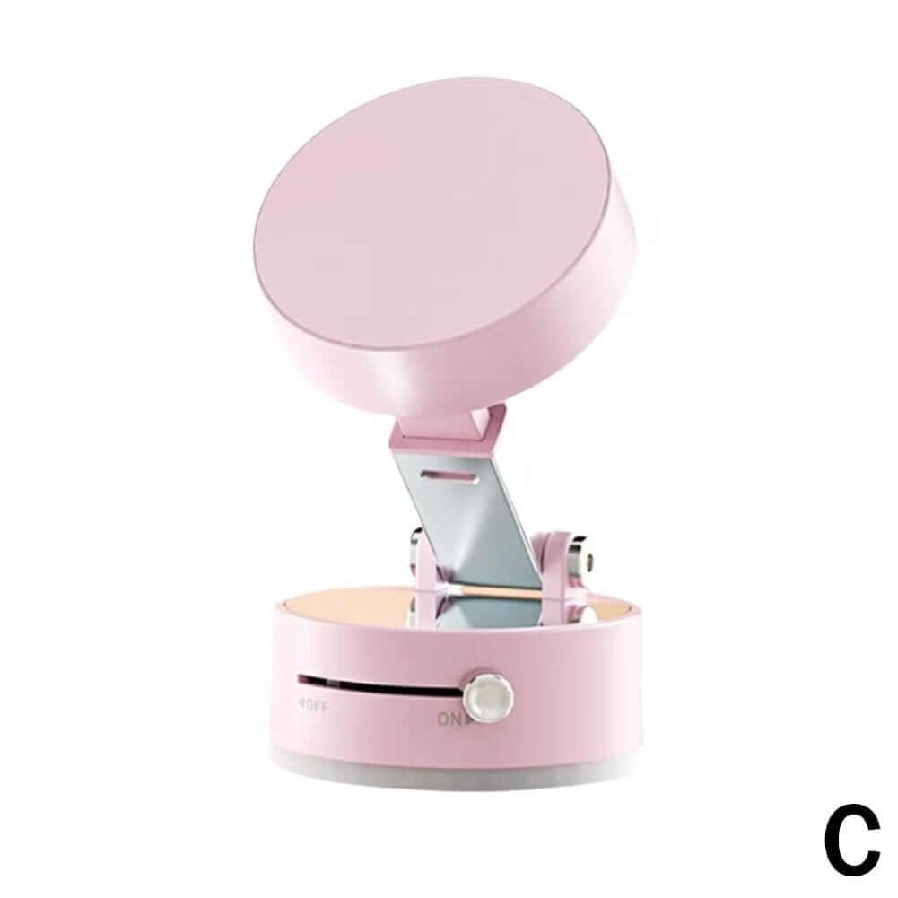 Magnetic suction cup phone holder in pink, featuring a compact design and one-button pressure release function.
