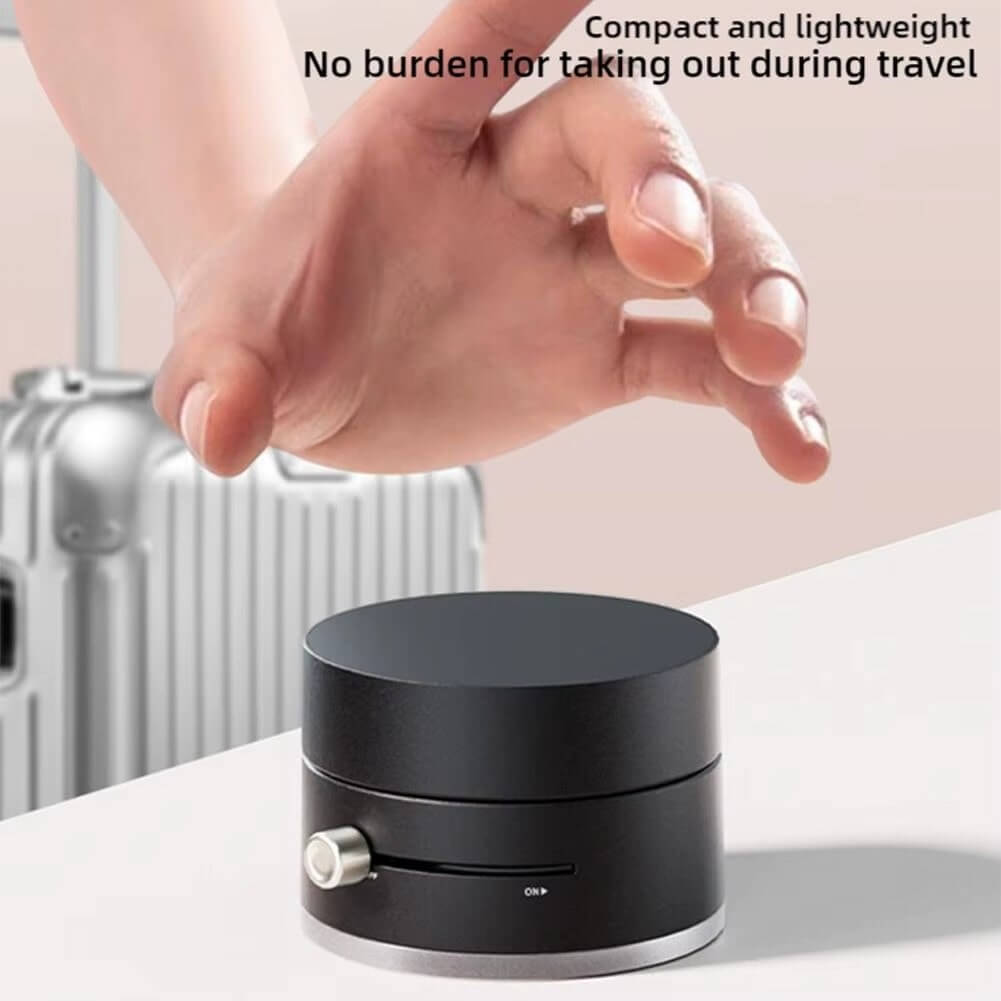 Magnetic suction cup phone holder shown with a hand demonstrating its compact and lightweight design for travel.